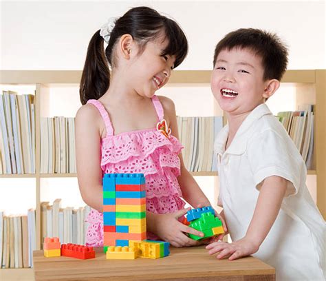 Kids Sharing Toys Stock Photos, Pictures & Royalty-Free Images - iStock