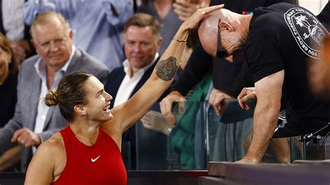 Aryna Sabalenka continues bizarre pre-match ritual of signing her fitness coach's head... as the ...