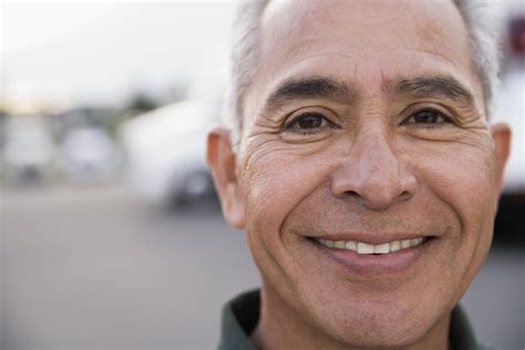 older man smiling outdoors - Wyoming Department of Health