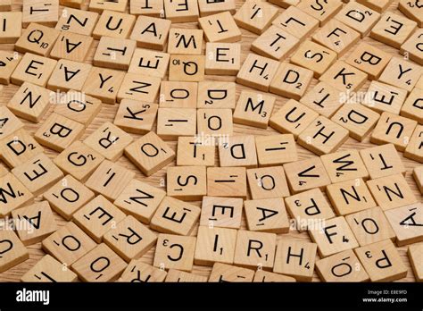 Jumble of wooden Scrabble letter tiles Stock Photo - Alamy