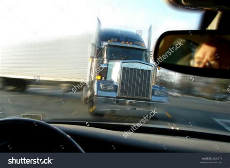 stock-photo-close-call-imminent-crash-accident-with-a-tractor-trailer-truck-viewed-from-inside-a ...