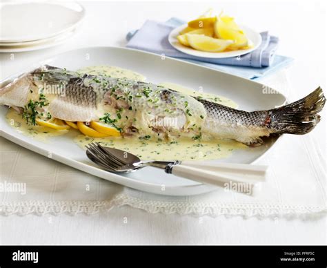 Sea bass with lemon butter Stock Photo - Alamy