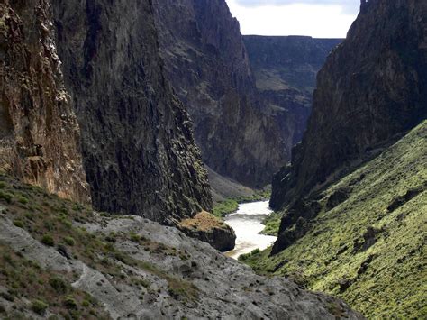 there is a river in the middle of some mountains