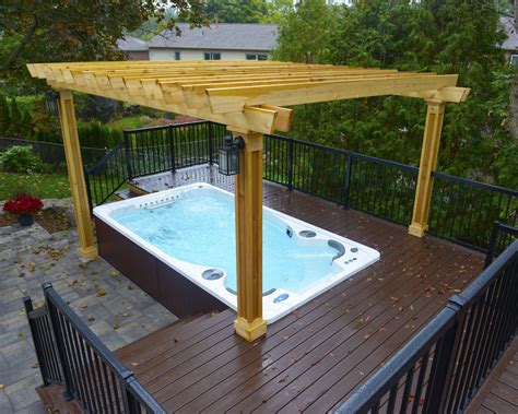 Hydropool Self Cleaning swim spa installed into a deck with gazebo | Hot tub pergola, Swim spa ...