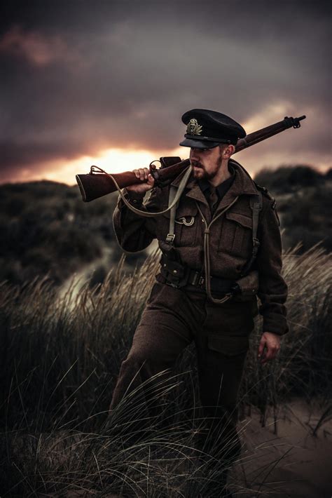 Photo Of A Man Holding A Gun · Free Stock Photo