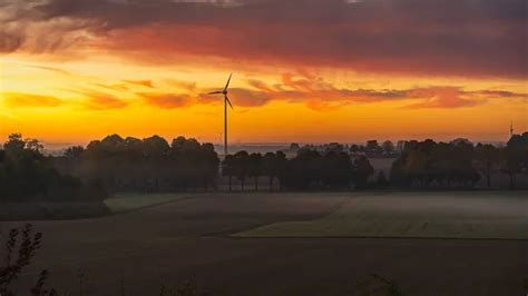 Sunset and wind turbine Stock Photos, Royalty Free Sunset and wind ...