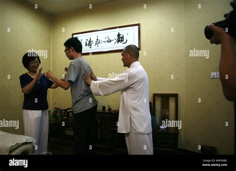 Chinese Tai Chi master Yan Fang (L) demonstrates Pushing Hands, a ...