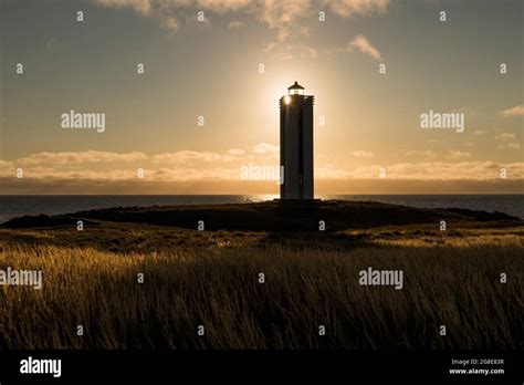 Lighthouse in the backlight, Kalfshamarsvik, peninsula Skagi, Iceland Stock Photo - Alamy