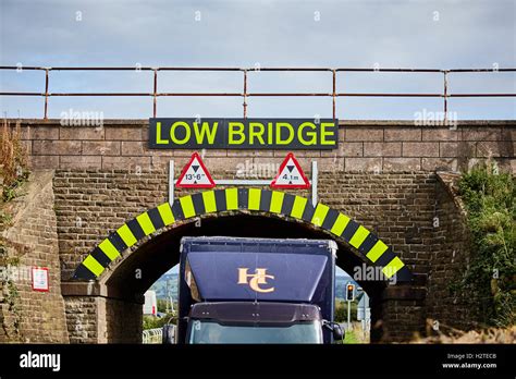 Low Bridge warning sign strike hgv lorry stuck Adlington Manchester to Macclesfield line ...