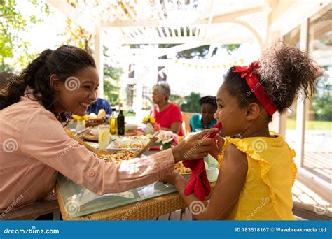 Family Eating Together at Table Stock Image - Image of senior, sunny: 183518167