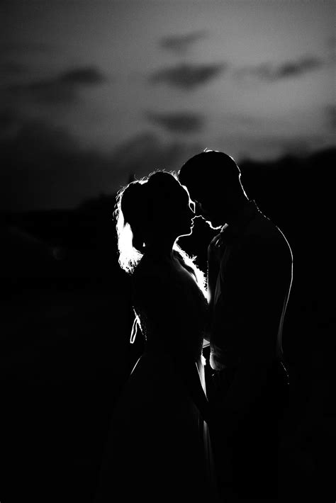 Black & white photography: Silhouette of young couple embracing in shadows | Black and white ...