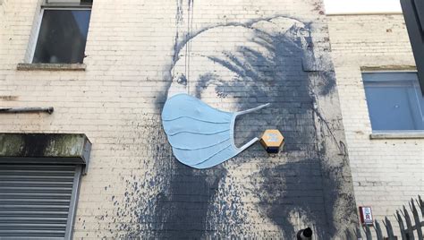 Did Banksy just add a face mask to one of his murals? | Creative Bloq