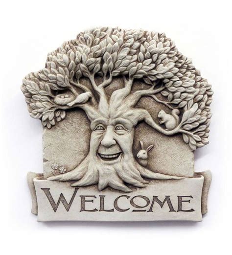 Extend a warm greeting to all your guests with this delightful Cast Stone Happy Tree Welcome ...