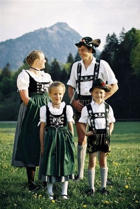 Germany & Austrian Typical dirndl skirted pinafores for the women and lederhosen for the men ...