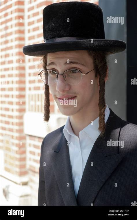 Posed portrait of a teenage Hasidic Jewish boy from the Satmar group ...