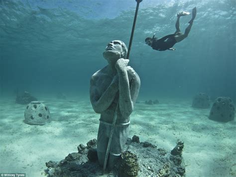 18ft Atlas sculpture dropped off coast of the Bahamas to form incredible underwater art garden ...