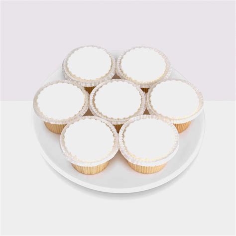 cupcakes on a plate with white frosting