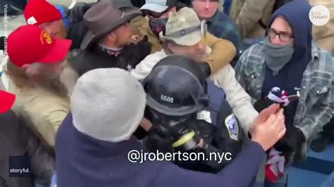 US Capitol riot: Police officer dragged down steps and beaten