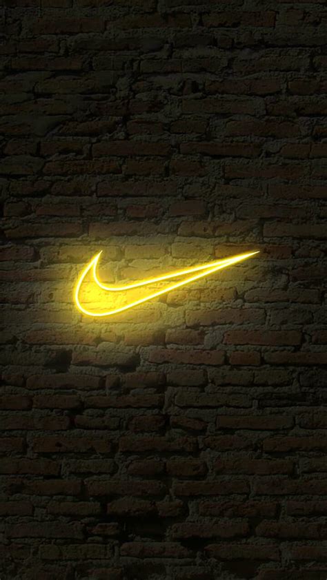 Nike, brand, brick, logo, neon, sport, wall, yellow, HD phone wallpaper | Peakpx