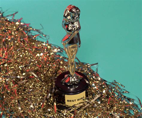 a trophy sitting on top of a pile of confetti