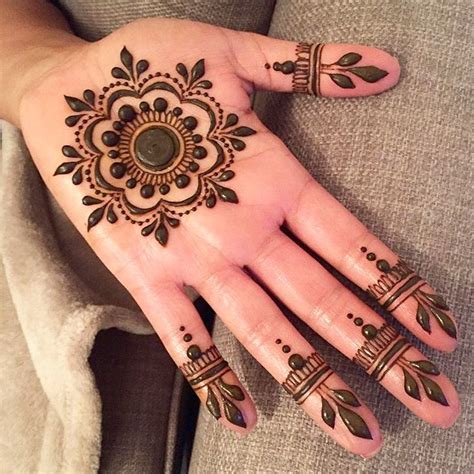 Beautiful Henna Tattoos on a Woman's Hand