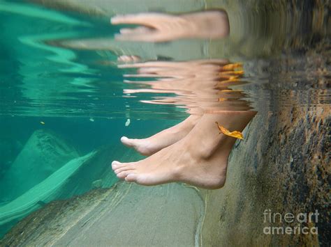 Feet underwater Photograph by Mats Silvan