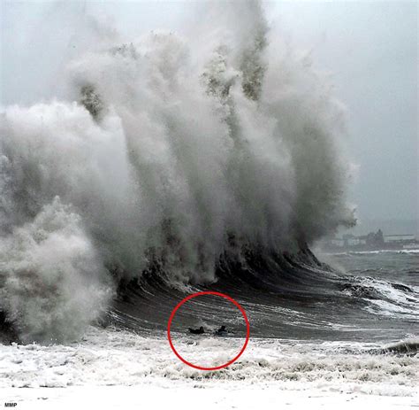 Caught on camera: Incredible moment surfers are hit by 50ft wave off ...