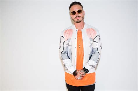 J Balvin is conquering the music industry with style. From Saint Laurent's heart-shaped cape to ...