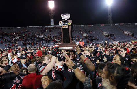 arkansas state red wolves football | Pictured: ASU football team members and fans celebrate ...