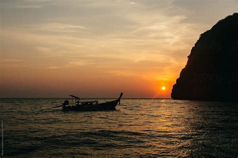 "Silhouette Of A Boat At Sunset" by Stocksy Contributor "Mauro Grigollo" - Stocksy