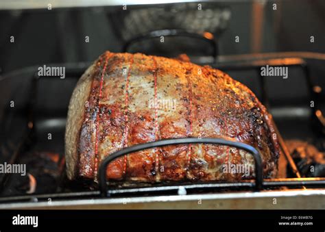 Joint of beef topside roasting in a fan oven for Sunday lunch UK Stock Photo - Alamy