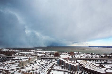 Storm clouds and snow blows off Lake Erie in Buffalo, New York