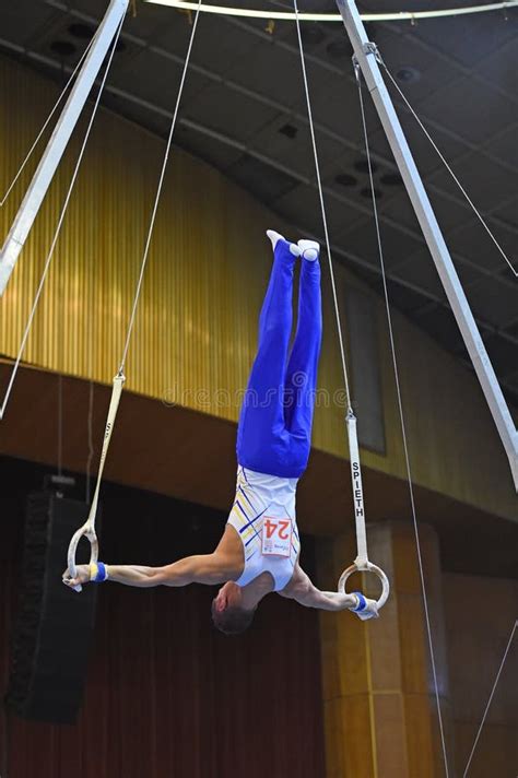 Male Gymnast Performing on Stationary Gymnastic Rings Editorial Photo - Image of energy, hand ...