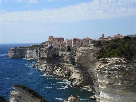 Bonifacio Corsica. The old-town clinging to the tops of the (rather worryingly eroded) cliffs is ...