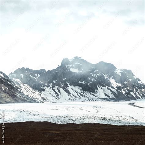 Snow covered mountains in Iceland Stock Photo | Adobe Stock