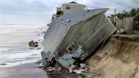 A house slides into the Atlantic Ocean in the aftermath of Hurricane Irma in Ponte Vedra Beach ...