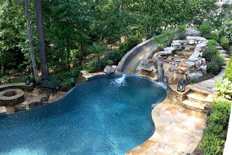 pool with slide waterfall grotto cave | Beautiful pools, Backyard pool ...