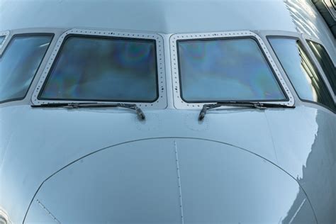 Premium Photo | Close up of a jet airplane cockpit front view of the airplane window with ...