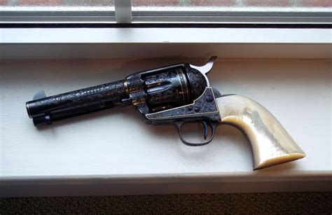 Anyone own this fine engraved gun?