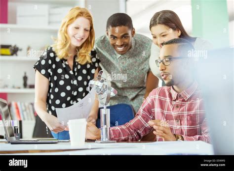 People working together in office Stock Photo - Alamy