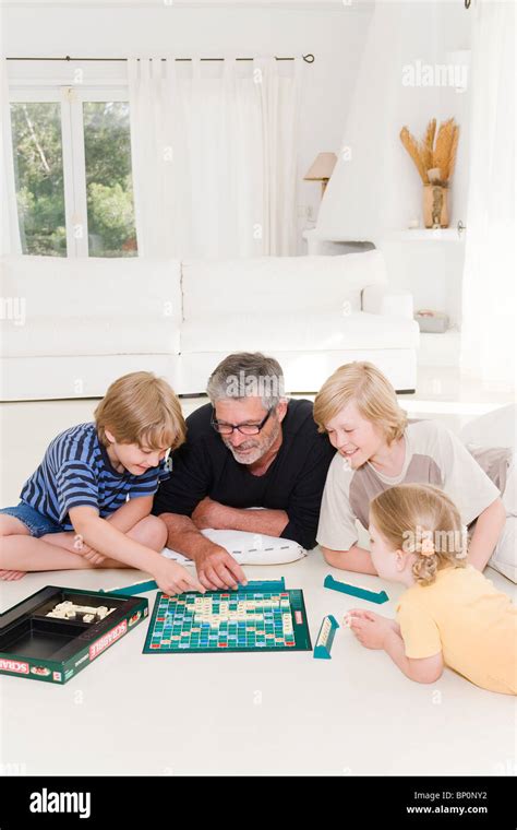 Family playing scrabble Stock Photo - Alamy