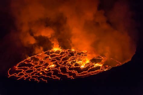 the lava is glowing red and yellow as it erupts