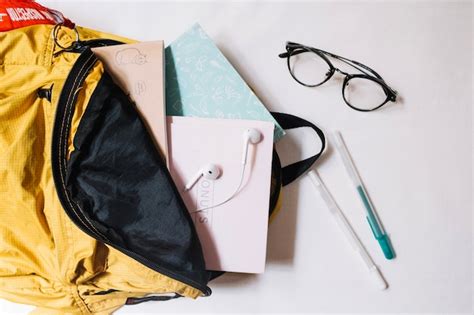 Glasses near backpack with notebooks Photo | Free Download