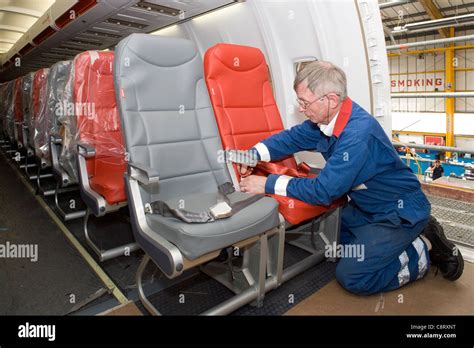 Boeing 757 cabin refurbishment fitting seat belts Stock Photo: 39863876 - Alamy