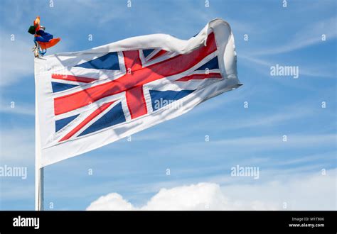 The british flag waving in the wind Stock Photo - Alamy