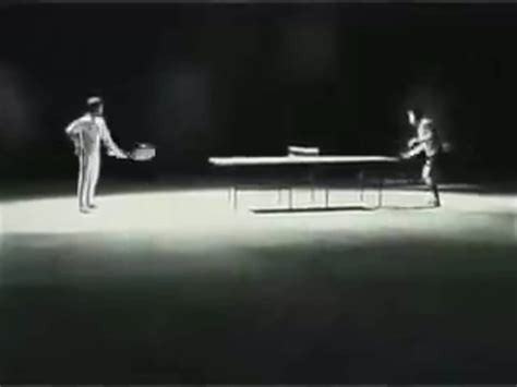 Bruce Lee playing ping-pong with nunchucks.