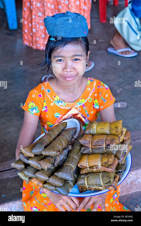 Woman with basket on her head selling food, Yangoon, Myanmar Stock Photo - Alamy