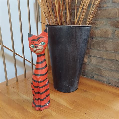 Large Metal Urn and Wooden Cat Statue (LR-JS) | EstateSales.org