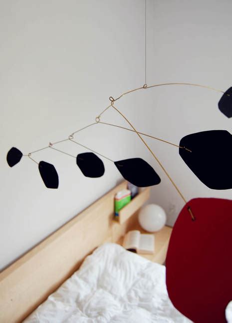 How to make a DIY Calder Mobile sculpture for under $10. A mid-century modern home decor project ...