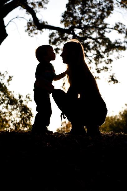 Silhouette Of The Two Little Kids Kissing Stock Photos, Pictures & Royalty-Free Images - iStock